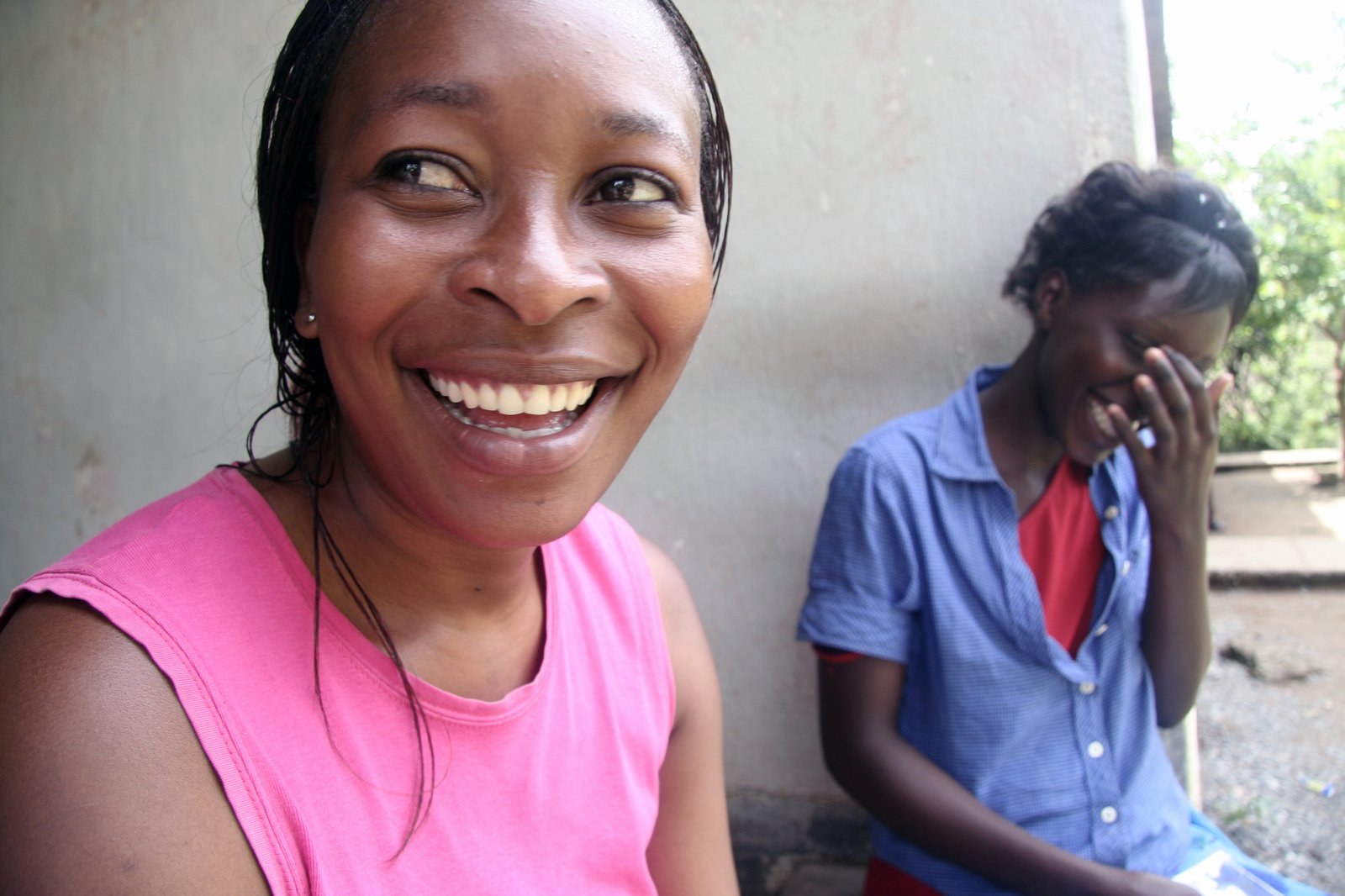 02101_hr.jpg . Two women laughing in Zambia. Photo PATH/David Jacobs.