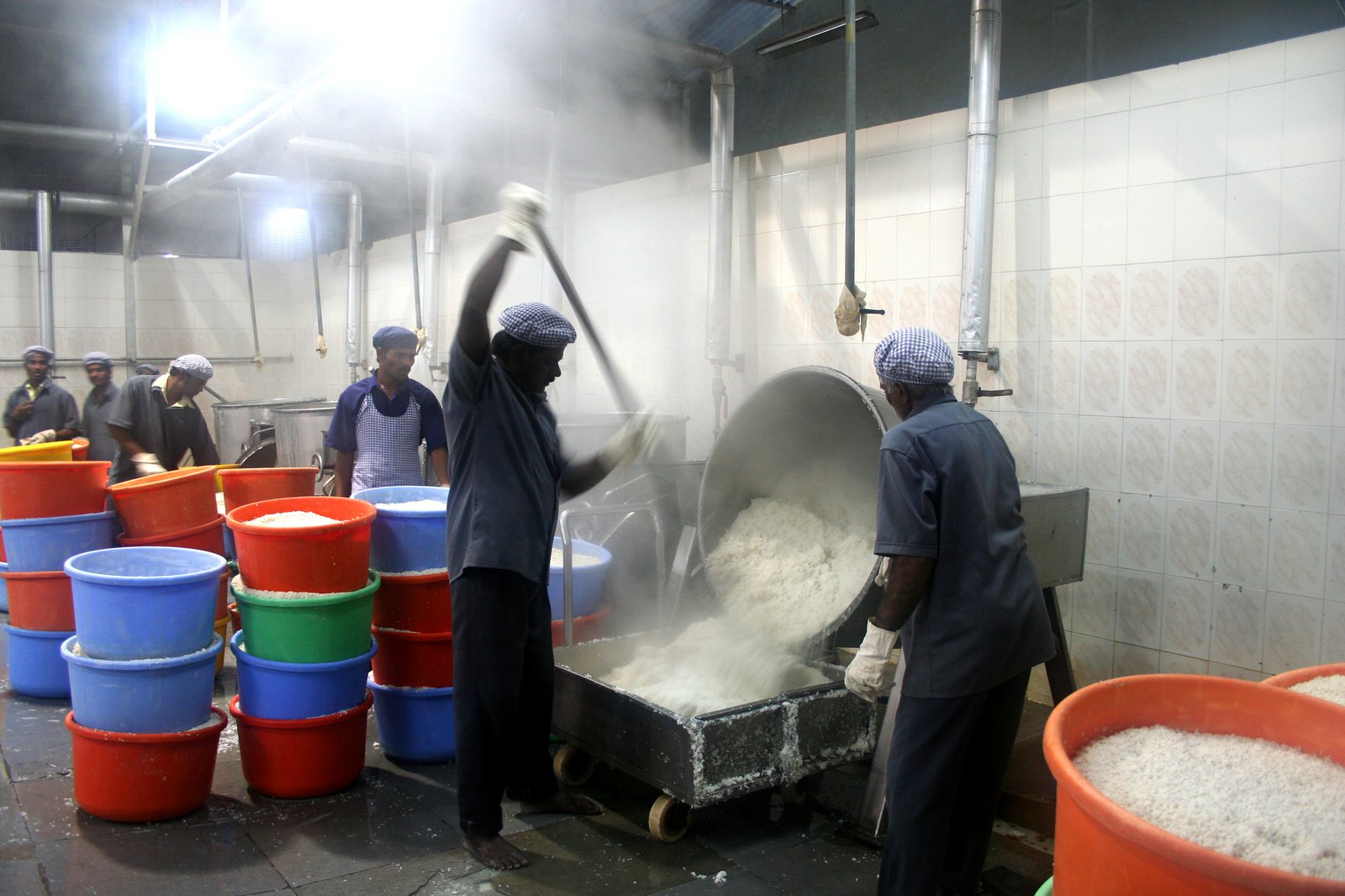 05433_hr . Workers cooking rice in a food preparation facility School Lunch Program. Hyderabad, Andhra Pradesh.