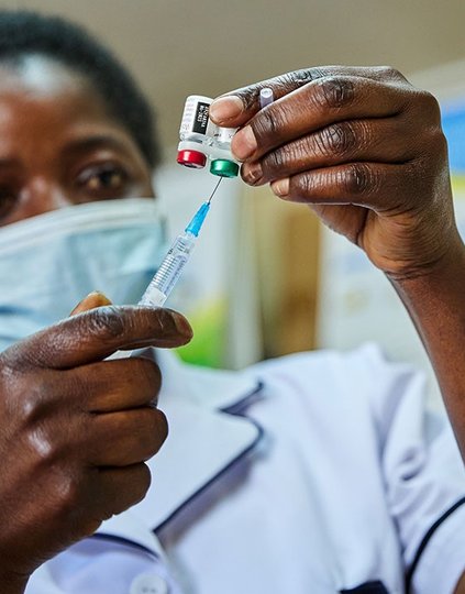 Nurse Janet Wanyama prepares to vaccinate a child with the RTS,S/AS01 malaria vaccine at Malava County Hospital in Kakamega, Kenya. Photo: Gavi/2021/White Rhino Films-Lameck Orina.