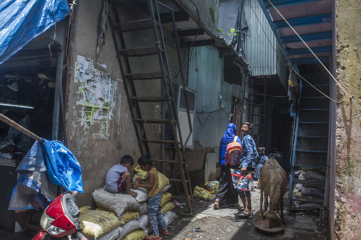 A narrow lane inside a slum in the city of Mumbai, India. The densely crowded slums are home to many tuberculosis patients.