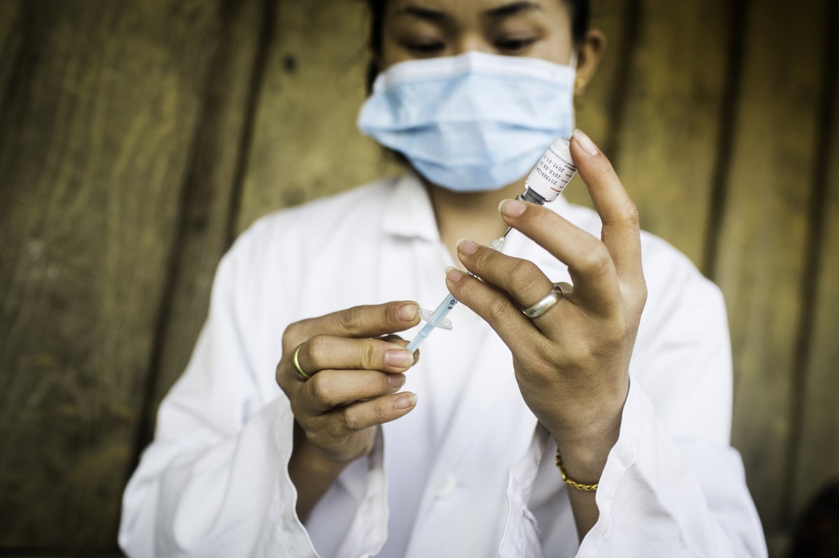 Health worker in Laos prepares a Japanese encephalitis vaccine.