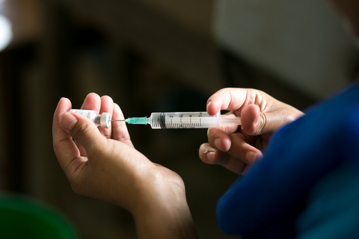 A health worker prepares a vaccine. Photo: PATH/Rocky Prajapati.