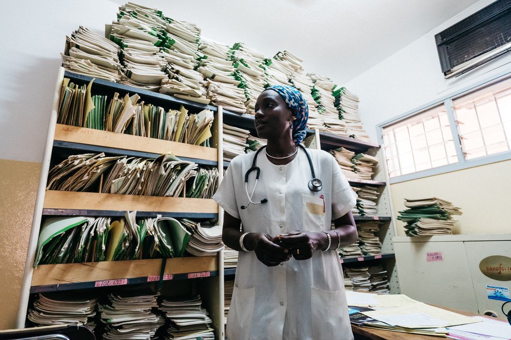 Dr. Maimouna Ndour Mbaye, a diabetes specialist, standing in a records room at the Marc Sankale Diabetes Center in Dakar, Senegal. Photo: PATH/Gabe Bienczyck