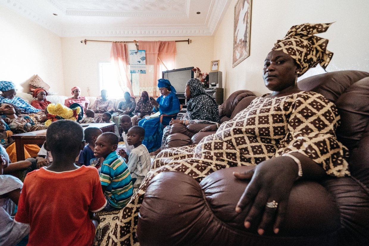 Women and children attending a community meeting.