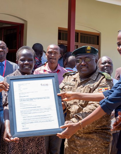 Staff of Mbale Diagnostic Vet Lab and the Uganda Wildlife Authority Diagnostic and Research Vet Lab receive their accreditation certificates in Mbale City. Photo: PATH/ Deogratias Agaba.