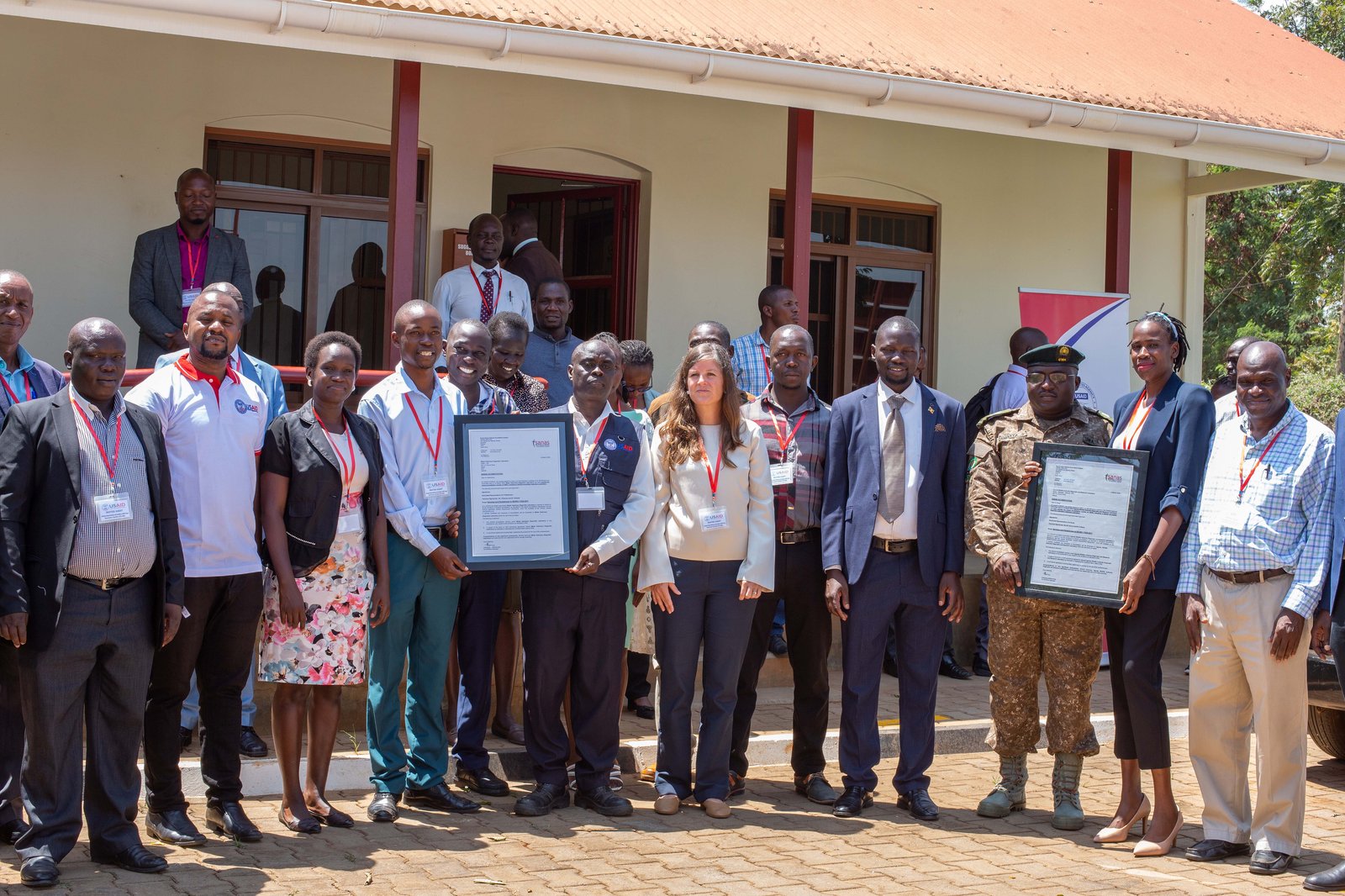 Staff of Mbale Diagnostic Vet Lab and UWA Diagnostic and Research Vet Lab receive their accreditation certificates in Mbale City. Photo: PATH/ Deogratias Agaba.
