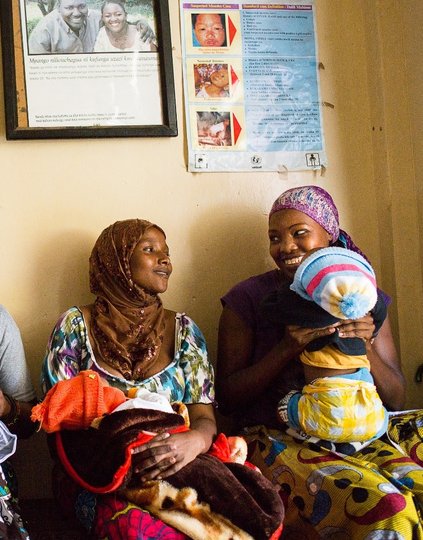 Women at health clinic with children. Photo: PATH/Trevor Snapp