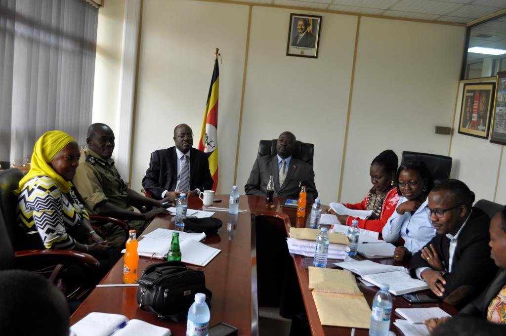 People meeting around a large table.