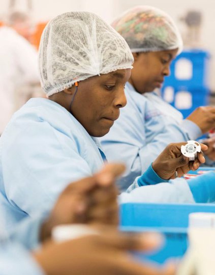Research staff at Sinapi Biomedical, a South African medical device manufacturer. Photo: PATH/Charles Meadows.