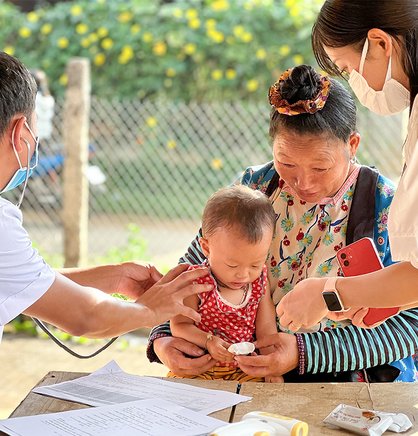 Photo: Health care workers in Vietnam conduct a supportive supervision session, an important activity for maintaining routine immunization coverage.