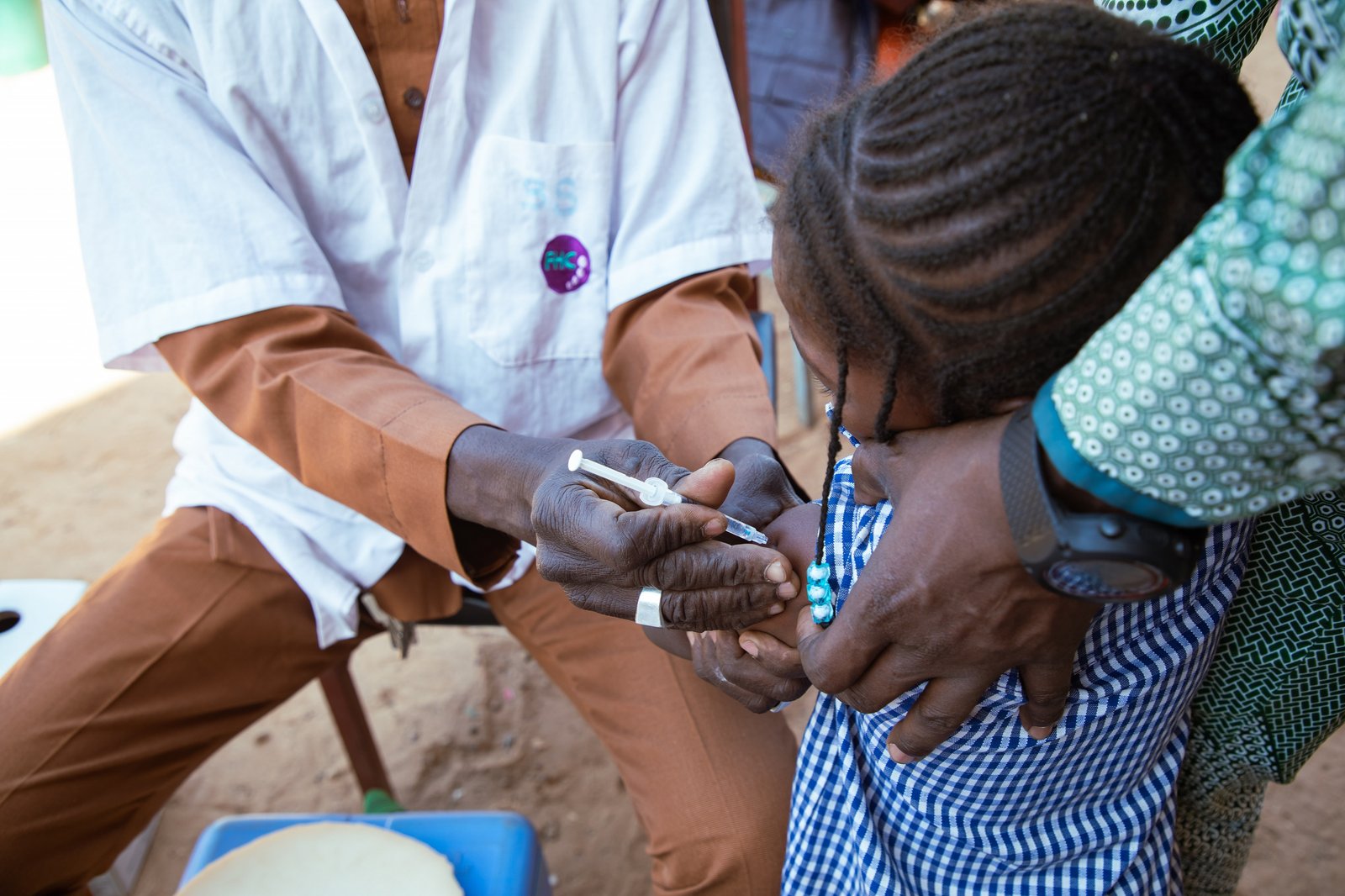 A child receives typhoid conjugate vaccine during Burkina Faso's introduction campaign. Photo: PATH/Build Africa Communications.