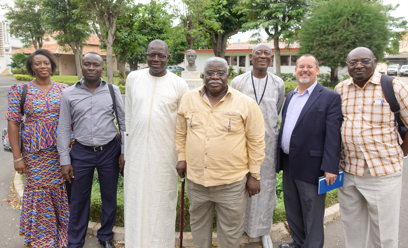 PATH staff from Senegal and the Democratic Republic of the Congo stand together outside.