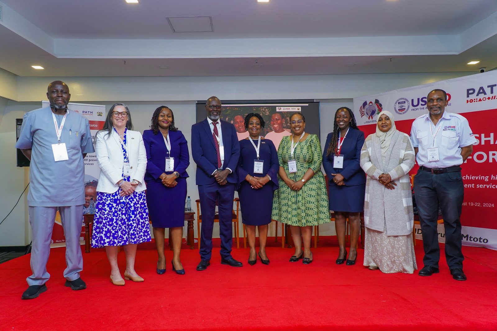 Event chief guest Dr. Gregory Ganda, Kisumu County Executive Committee member (in blue suit), with USAID, PEPFAR, and PATH leaders. Photo: PATH.