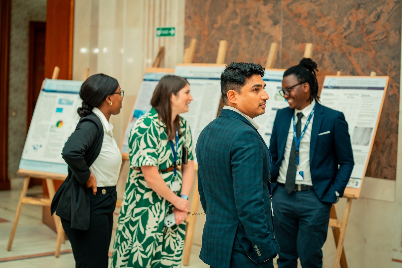 PATH staff peruse the poster showcase at the National Oxygen Scale-Up Framework Meeting, learning about different partners’ activities in scaling oxygen access. Photo: World Health Organization; MLD Design.