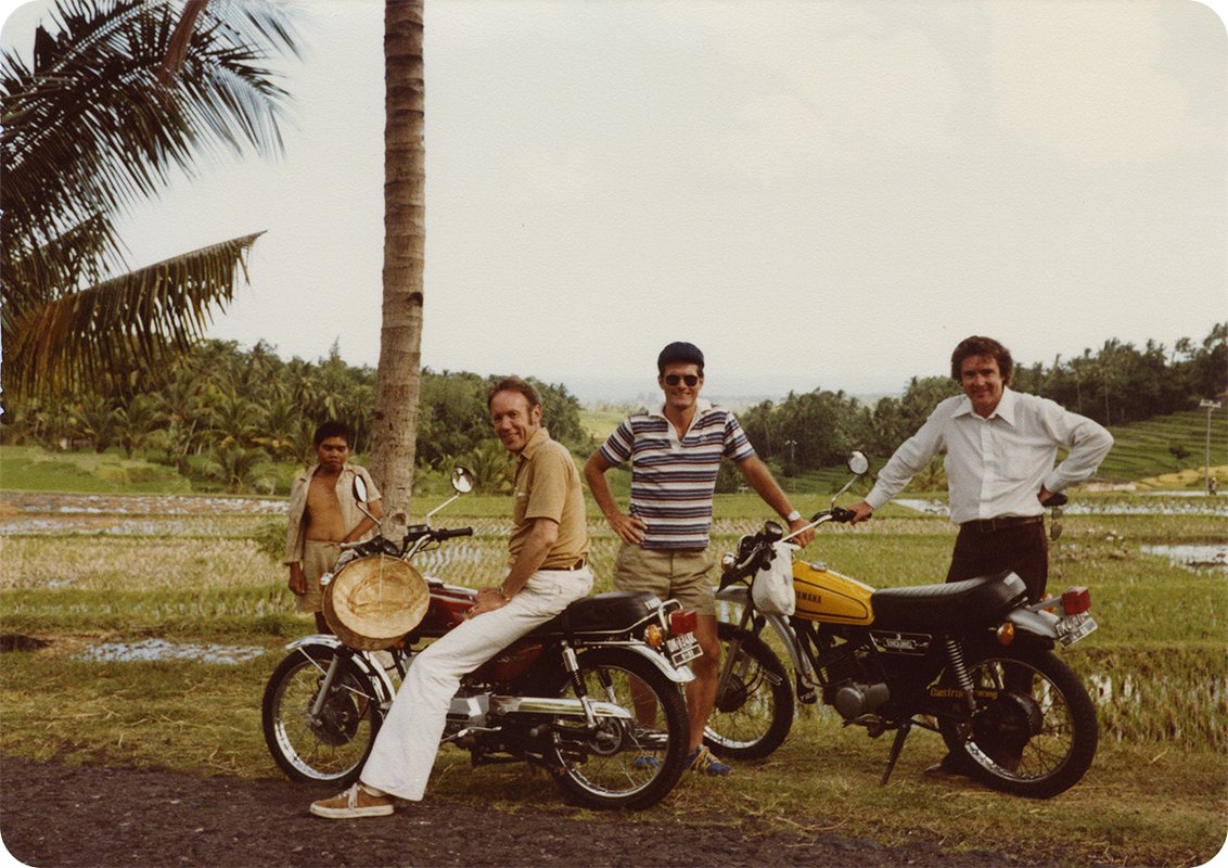 PATH’s three cofounders with two motorocycles.