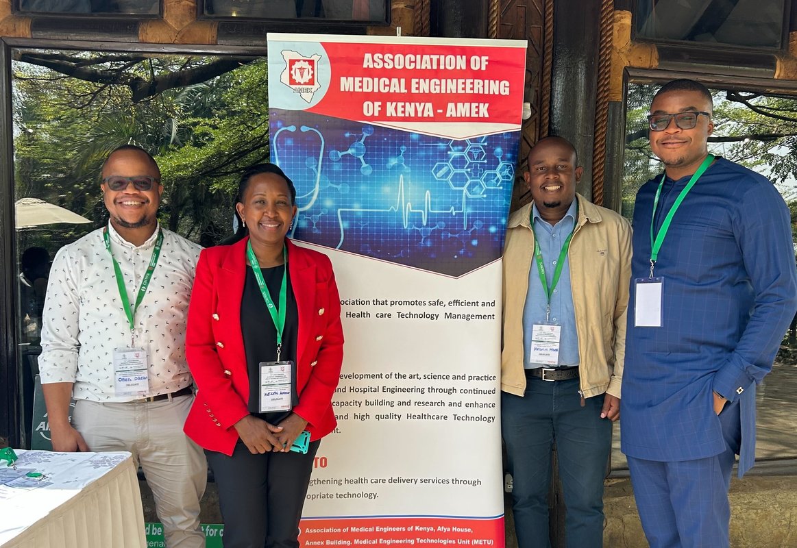 Helen Kamau, regional lead for PATH’s Access to Medical Devices portfolio, stands with representatives from Build Health International at Africa’s 1st Regional Biomedical Engineering and Health Technologies Conference in Nairobi, Kenya. Photo: BHI
