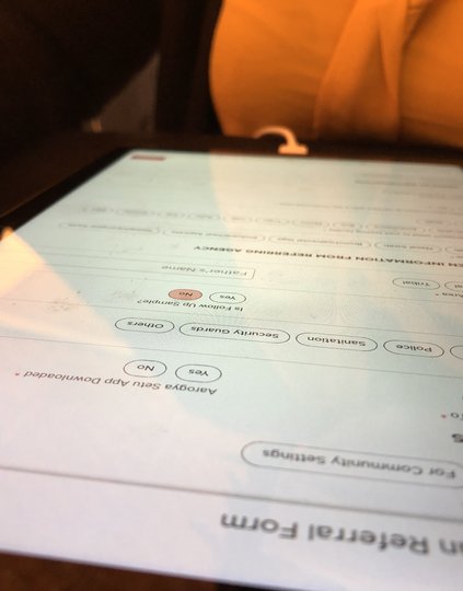 A health care worker testing the Connection Loops COVID-19 data management tool. Photo: PATH/Tony Mapulanga.