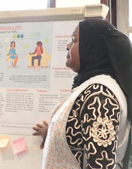 Health workers present new solutions to health officials at a PATH Living Labs exhibition in Nairobi.