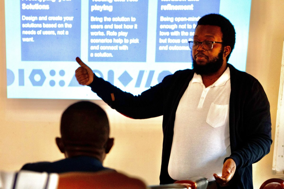 John Zgambo, an Innovation and Design Lead with PATH's Living Labs, gives a presentation on new solutions under development.