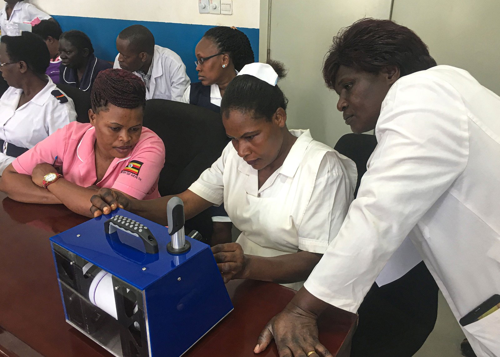 Photo: PATH. Nurses at Naguru Hospital review the RELI prototype in Kampala, Uganda as part of PATH’s user centered design activities.