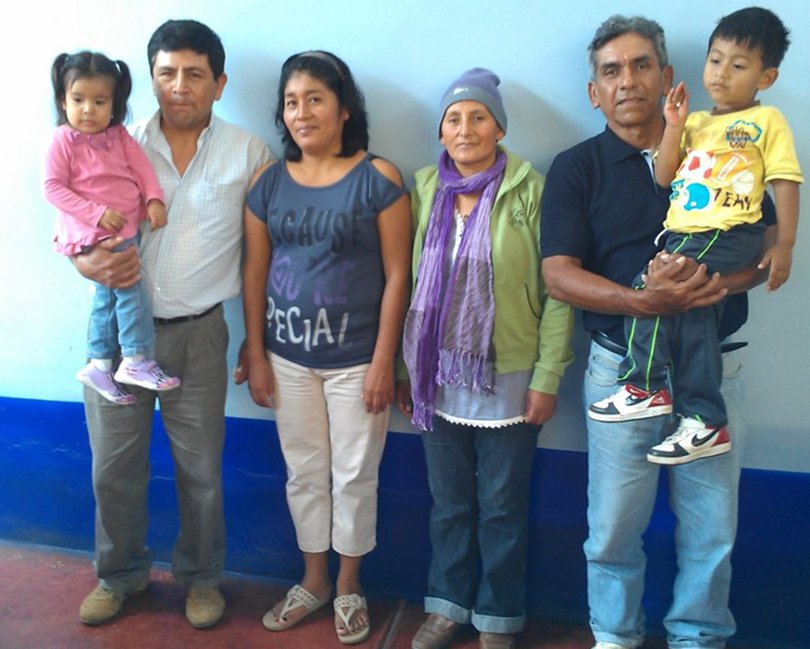 Two breast cancer survivors with their families.