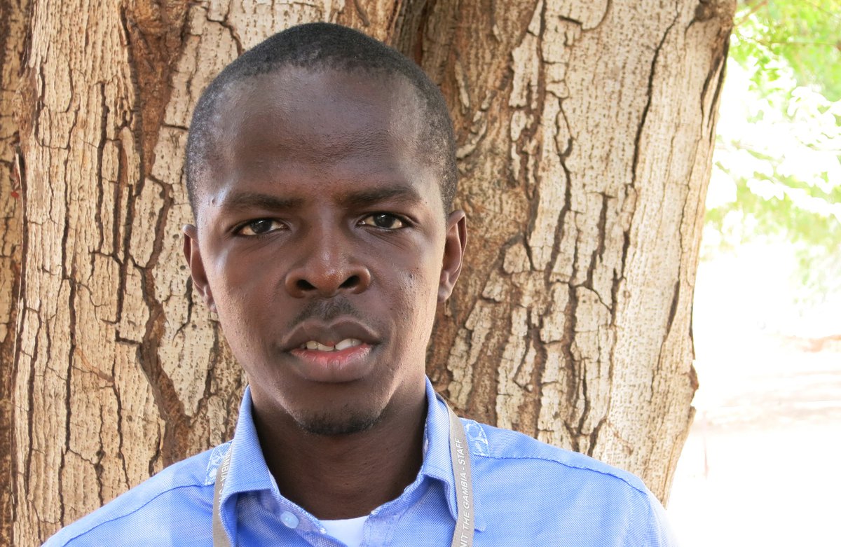 Adedapo Bashorun standing in front of a tree.