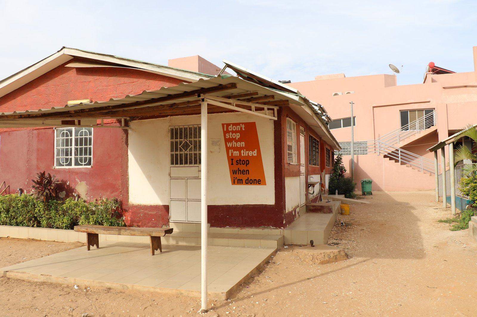 Small medical center with sign, "I don't stop when I'm tired; I stop when I'm done."