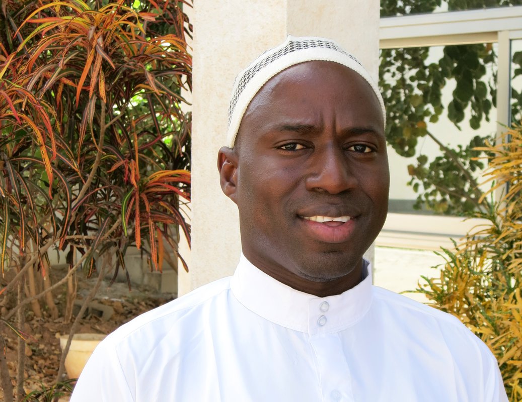 Dawda Sowe standing outside.