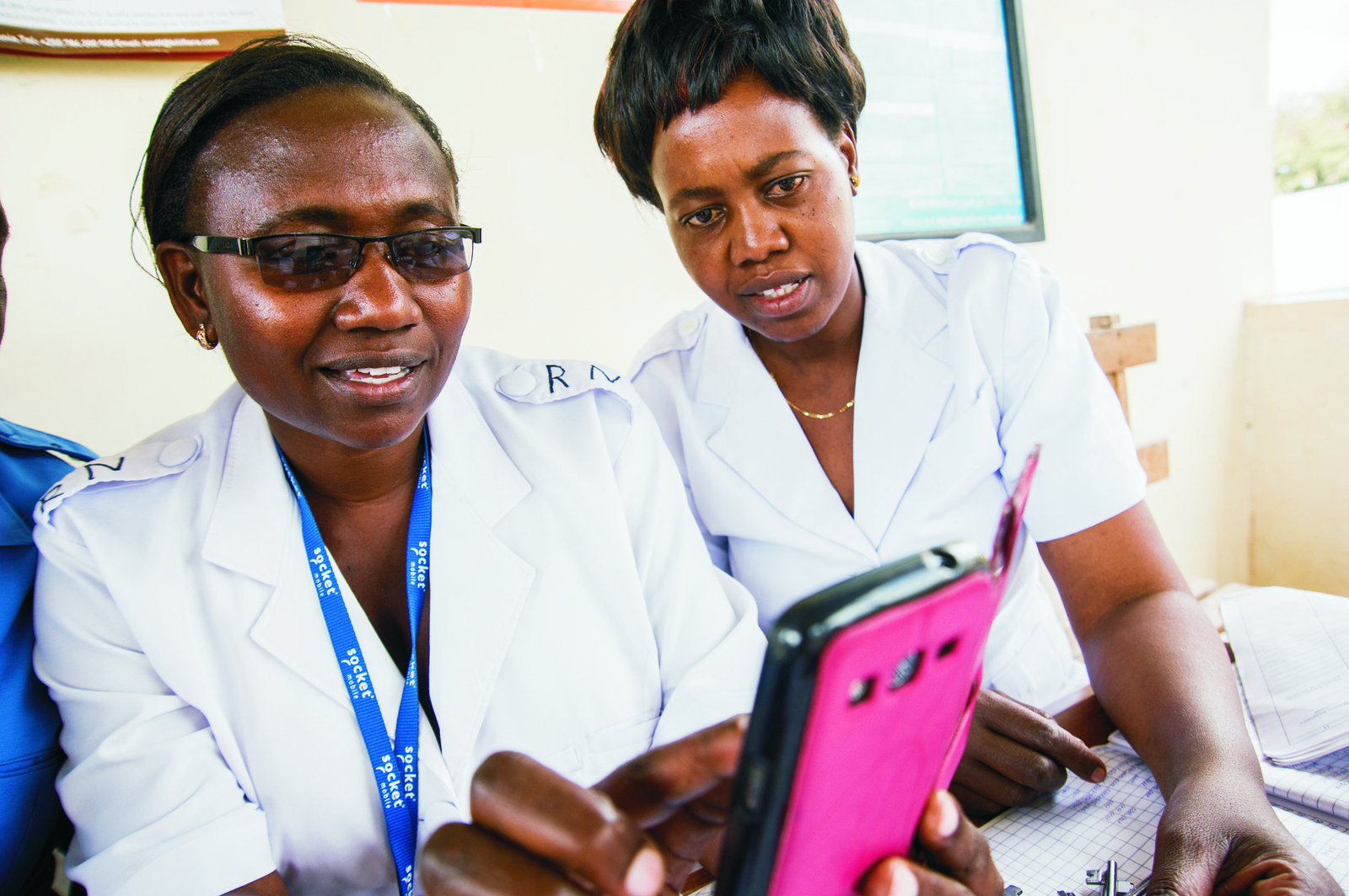 Nurses in Tanzania look at a smartphone. Bill & Melinda Gates Foundation/Riccardo Gangale