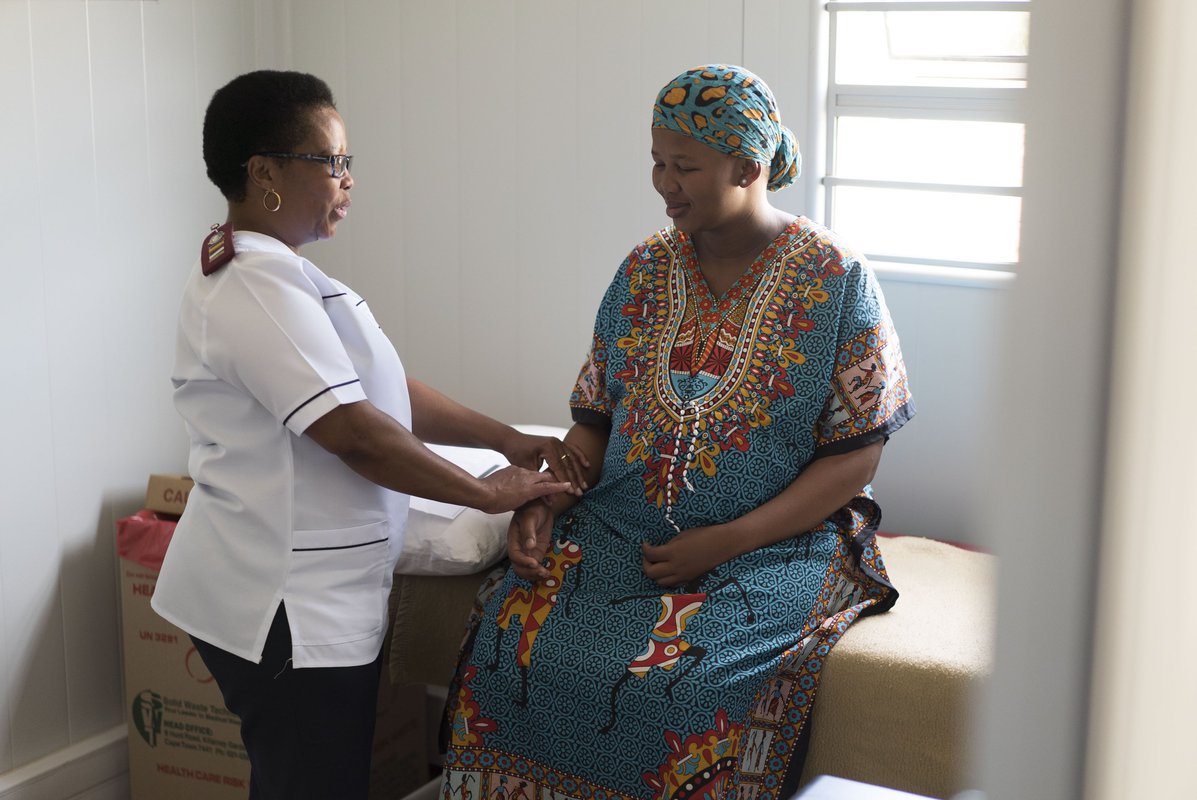 An expectant mother receives prenatal care at a clinic in South Africa. The vast majority of health services worldwide are delivered at the primary health care level. Photo: PATH/Charles Meadows.
