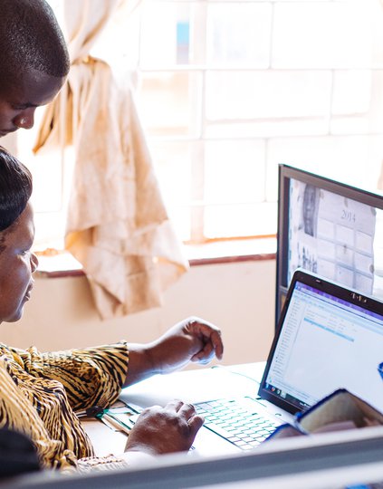 Government health workers in Zambia uses data visualization software to track malaria transmission in real time so that his team can treat, prevent, and eliminate cases before they spread further. Photo: PATH/Gabe Bienczycki.