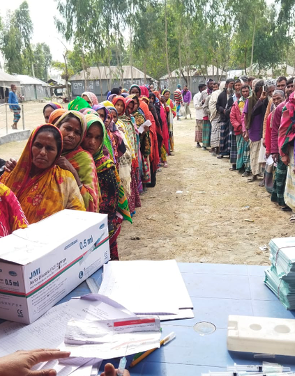 People line up to receive COVID-19 vaccinations during a two-day campaign in Kurigram, Bangladesh, on December 29, 2021. Photo: Bangladesh EPI/Dr. Borhan Siddiqui.