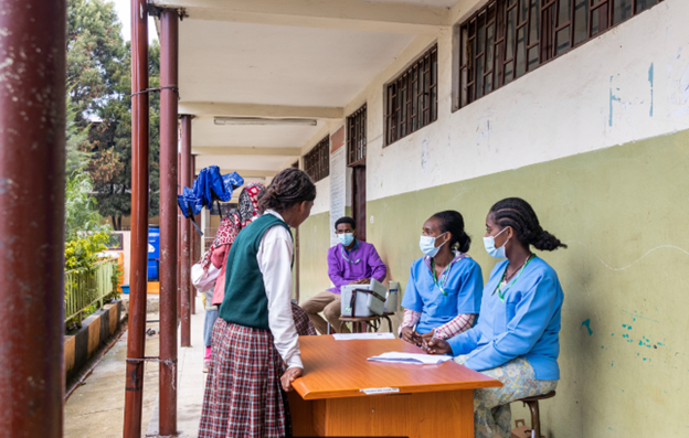 Tsegayenesh Tefera (right) and Zera Jaleta register students for the HPV vaccination at Felege Meles Primary School in Addis Ababa, Ethiopia. Photo: ©Gates Archive/Genaye Eshetu.