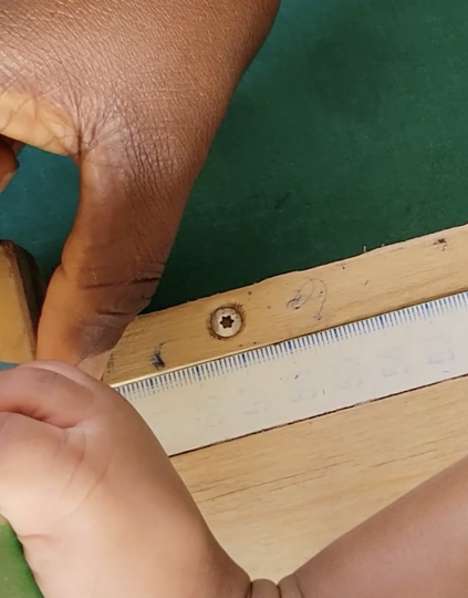 A newborn is measured during a routine checkup at a health clinic in Ghana. Photo: PATH.