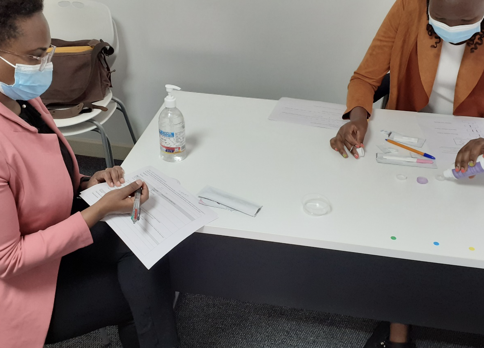 Sue Wairimu works with the Living Labs team in Kenya to test prototype forms for preeclampsia diagnosis. Photo: PATH/Brian Taliesin.